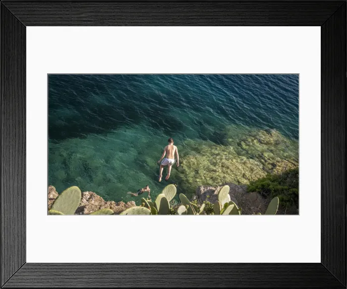Framed Print : Europe, Italy, Tuscany, Elba Island - Cliff juming in the bay of Barbarossa