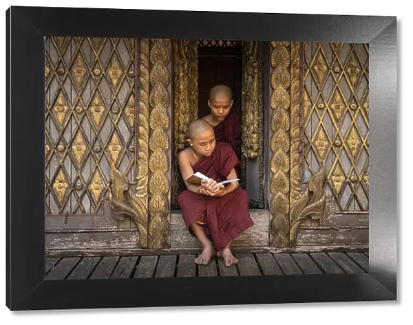 Two novice monks reading a book at a monastery, Mandalay, Mandalay District