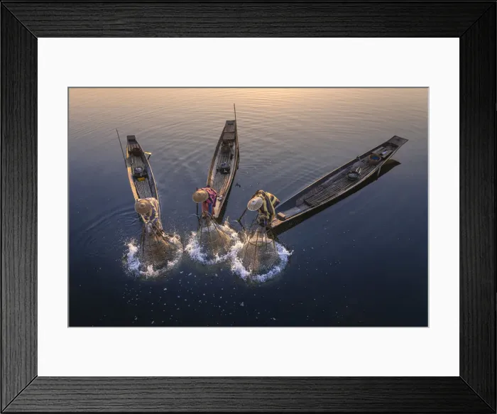 Framed Print : Elevated view of three fishermen catching fish from boats using traditional conical nets Framed Print : Elevated view of three fishermen catching fish from boats using traditional conical nets