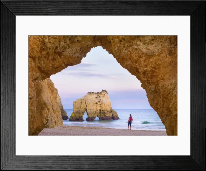 Framed Print : Portugal, Algarve, Alvor, Prainha, woman standing on beach (MR) Framed Print : Portugal, Algarve, Alvor, Prainha, woman standing on beach (MR)
