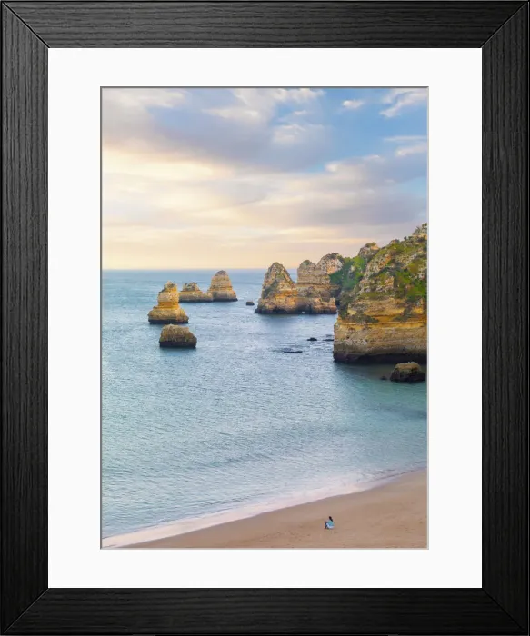 Framed Print : Portugal, Algarve, Lagos; Praia da Dona Ana, woman sitting on beach (MR) Framed Print : Portugal, Algarve, Lagos; Praia da Dona Ana, woman sitting on beach (MR)