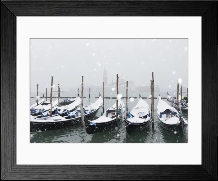 Framed Print : Winter snowfall in the city of Venice, gondolas covered by snow