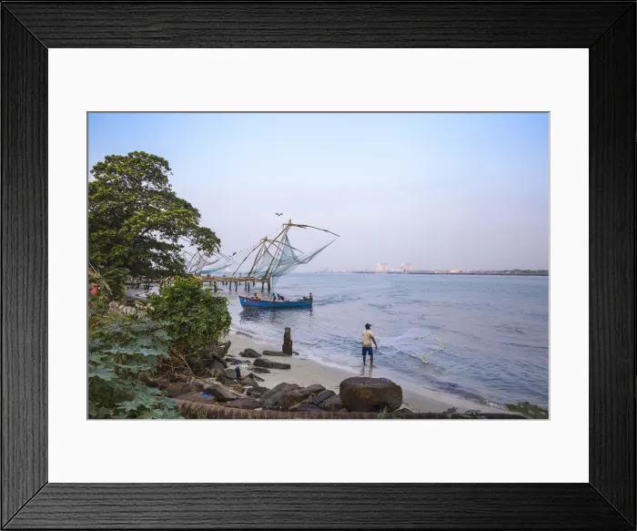Framed Print : India, Kerala, Cochin - Kochi, Vipin Island, Man fishing infront of Chinese fishing nets
