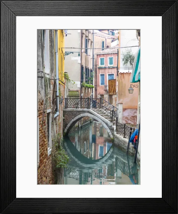 Framed Print : A bridge crosses a small canal, Castello, Venice; veneto; Italy Framed Print : A bridge crosses a small canal, Castello, Venice; veneto; Italy