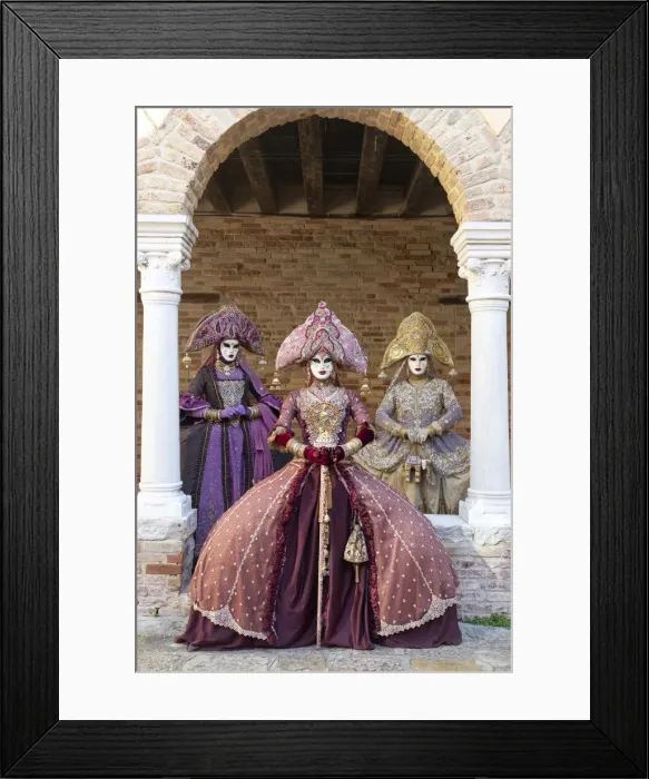 Framed Print : Three women wearing Indian style costumes and masks pose in the cloisters of Chiesa di Framed Print : Three women wearing Indian style costumes and masks pose in the cloisters of Chiesa di
