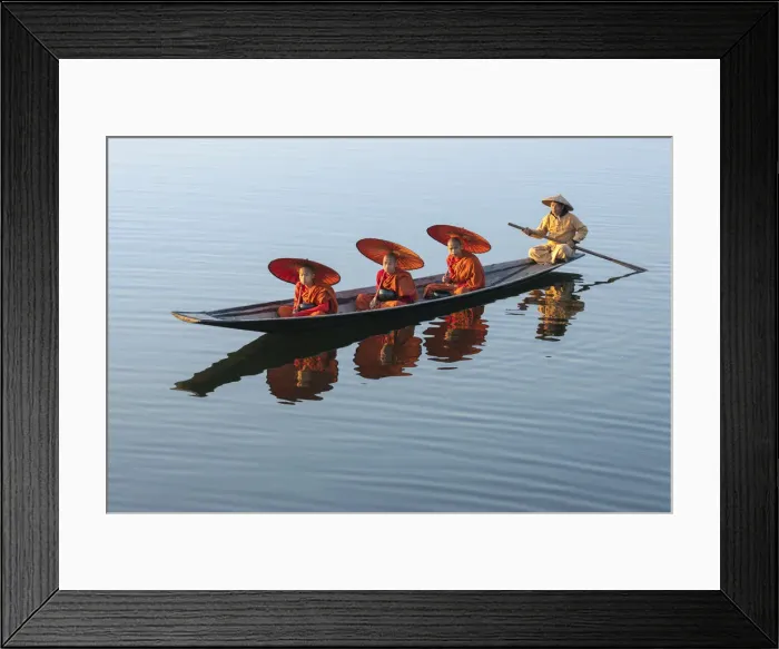 Framed Print : Three monks in orange robes with bowls for alms giving and a leg-rowing fisherman commute Framed Print : Three monks in orange robes with bowls for alms giving and a leg-rowing fisherman commute