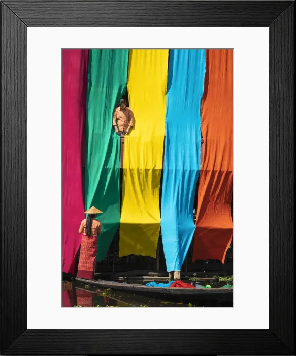 Framed Print : Two women checking freshly dyed fabric hanging from bamboo poles on a house to dry Framed Print : Two women checking freshly dyed fabric hanging from bamboo poles on a house to dry