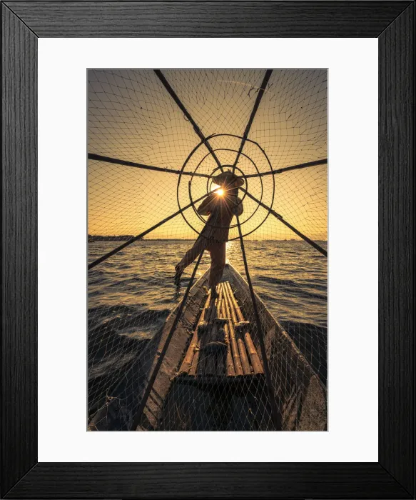 Framed Print : Traditional leg-rowing fisherman viewed through conical fishing net rowing a boat on Lake Framed Print : Traditional leg-rowing fisherman viewed through conical fishing net rowing a boat on Lake