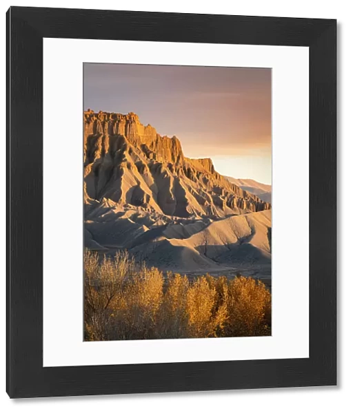 Badlands at South Caineville Mesa at sunset, Caineville, Utah, Western United States, USA