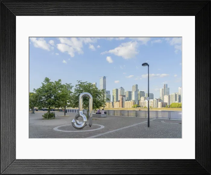 Framed Print : Curlicue sculpture by William Pye and Canary Wharf and the River Thames, London, England Framed Print : Curlicue sculpture by William Pye and Canary Wharf and the River Thames, London, England