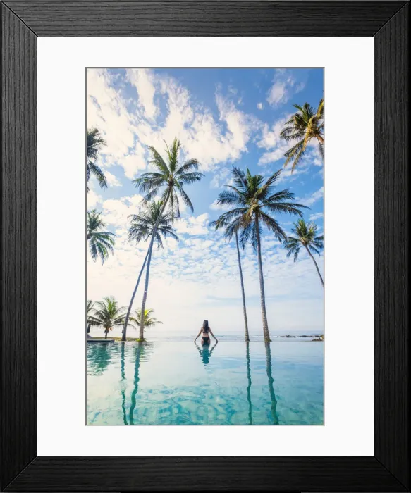 Framed Print : Southeast Asia, Indonesia, Bali, Candidasa. A woman looking out over the ocean from an Framed Print : Southeast Asia, Indonesia, Bali, Candidasa. A woman looking out over the ocean from an