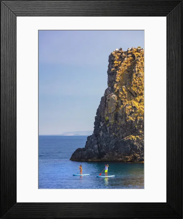 Framed Print : Aci Trezza, Sicily. People riding kayak with a sea stack in the background Framed Print : Aci Trezza, Sicily. People riding kayak with a sea stack in the background