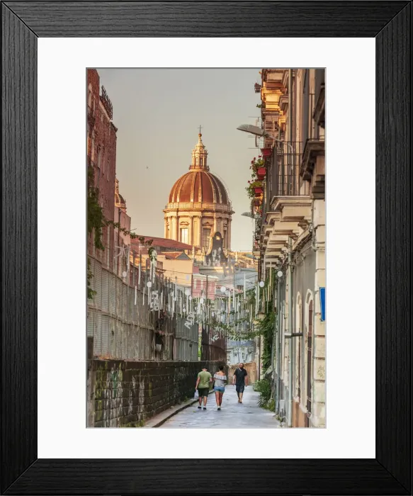 Framed Print : Catania, Sicily. A couple walking with the Cathedral in the background Framed Print : Catania, Sicily. A couple walking with the Cathedral in the background