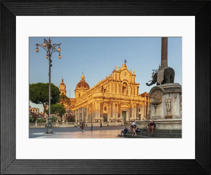 Framed Print : Catania, Sicily. People walking on the main square at sunset with the Cathedral in Framed Print : Catania, Sicily. People walking on the main square at sunset with the Cathedral in