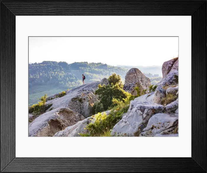 Framed Print : Montalbano Elicona, Messina. A woman standing on a rock in the Meghalitic site called Framed Print : Montalbano Elicona, Messina. A woman standing on a rock in the Meghalitic site called