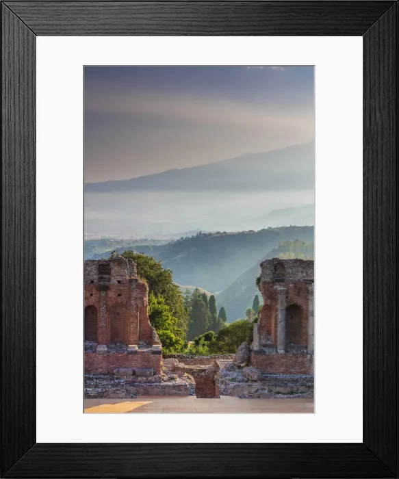 Framed Print : Taormina, Sicily. Sun setting on the greek theater with Etna volcano in the background