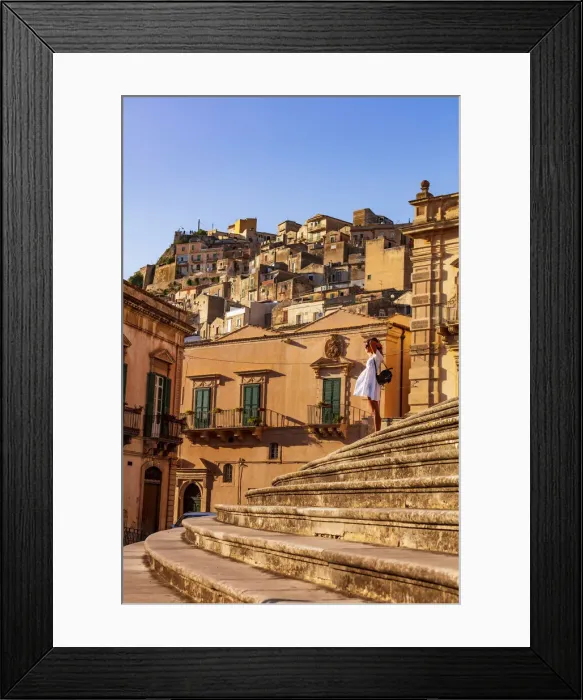 Framed Print : Modica, Sicily. A woman standing on the stairs in front of the baroque Cathedral Framed Print : Modica, Sicily. A woman standing on the stairs in front of the baroque Cathedral