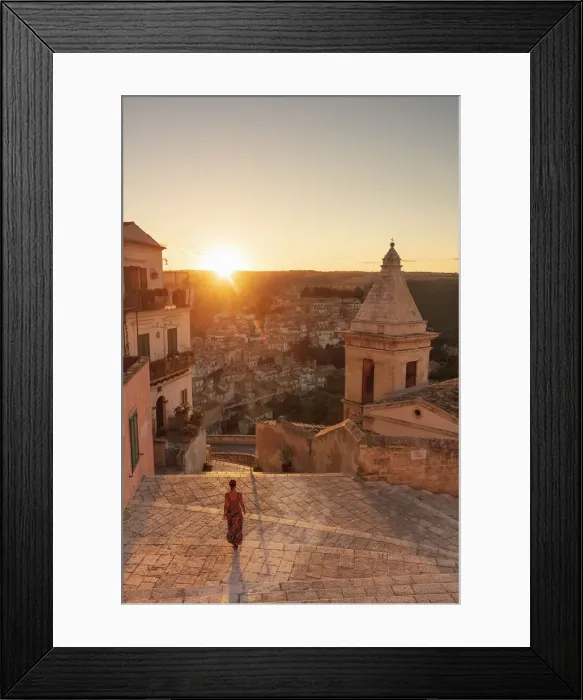 Framed Print : Ragusa Ibla, Sicily. A woman walking on the stairs with Ragusa old town in the background Framed Print : Ragusa Ibla, Sicily. A woman walking on the stairs with Ragusa old town in the background