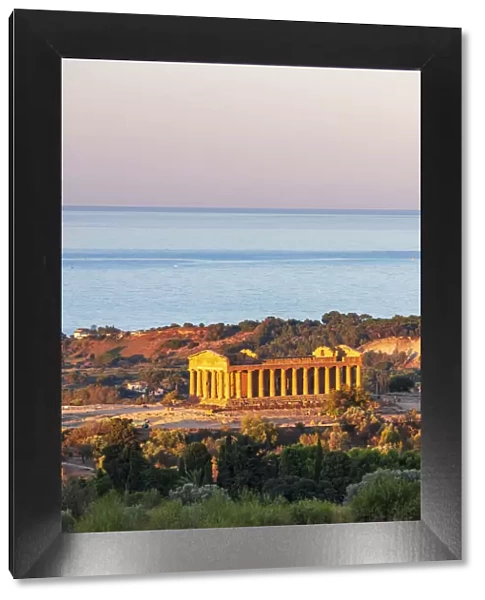 Agrigento, Sicily. Concordia Temple in the Valley of Temples at sunrise with the sea in