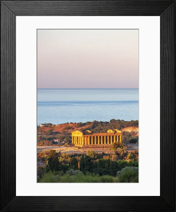 Framed Print : Agrigento, Sicily. Concordia Temple in the Valley of Temples at sunrise with the sea in