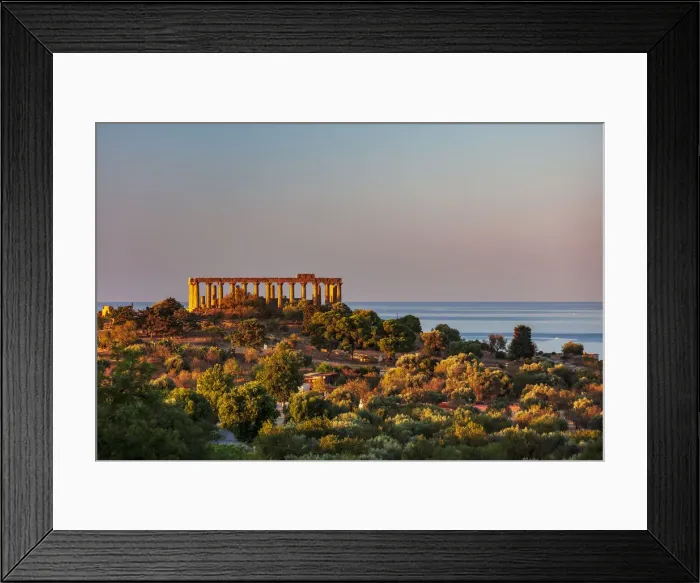 Framed Print : Agrigento, Sicily. Concordia Temple in the Valley of Temples at sunrise with the sea in Framed Print : Agrigento, Sicily. Concordia Temple in the Valley of Temples at sunrise with the sea in