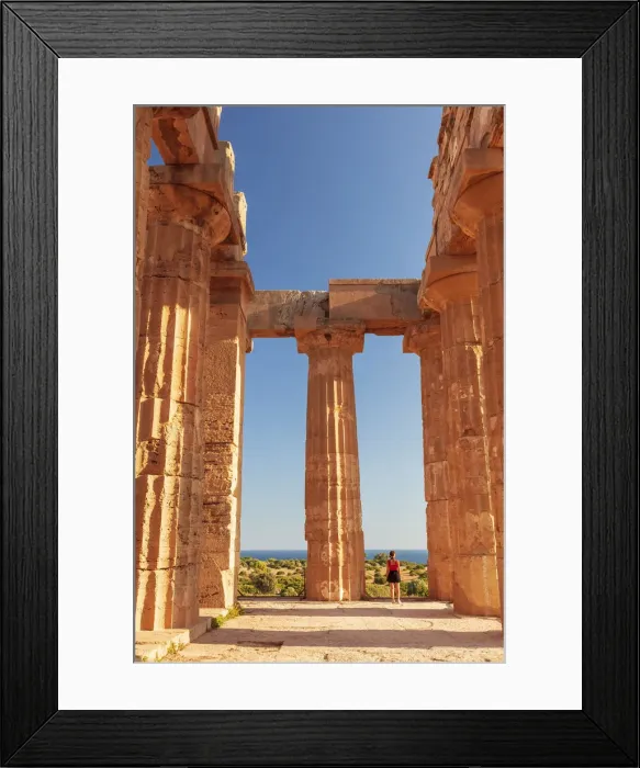 Framed Print : Selinunte, Sicily. A woman visiting an old Greek temple at with the sea in Framed Print : Selinunte, Sicily. A woman visiting an old Greek temple at with the sea in