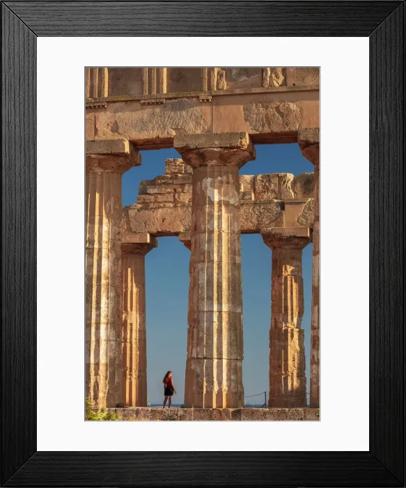 Framed Print : Selinunte, Sicily. A woman visiting an old Greek temple at sunset with the sea in Framed Print : Selinunte, Sicily. A woman visiting an old Greek temple at sunset with the sea in