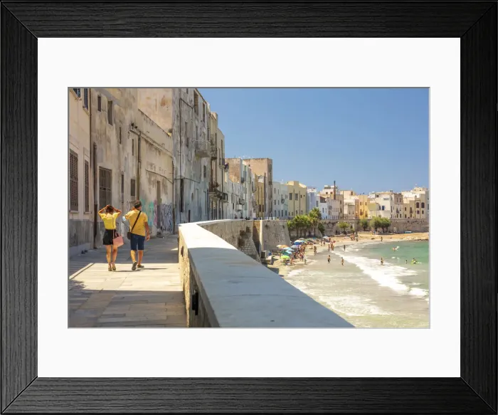 Framed Print : Trapani, Sicily. Seascape of the town with people walking on the baroque street Framed Print : Trapani, Sicily. Seascape of the town with people walking on the baroque street