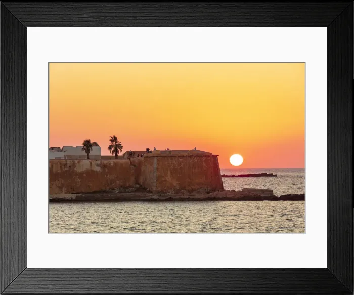Framed Print : Trapani, Sicily. Seascape of the Ligny tower with the sun setting in the sea