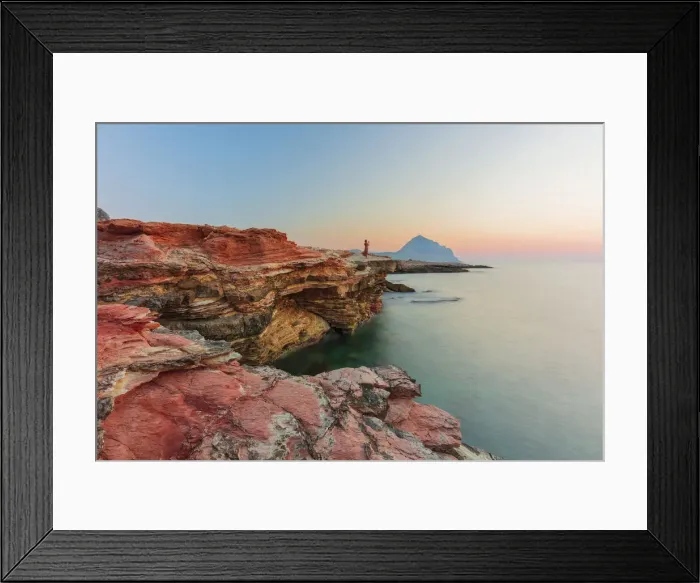Framed Print : San Vito lo Capo, Sicily. A person enjoying the view of the sun setting along the rock Framed Print : San Vito lo Capo, Sicily. A person enjoying the view of the sun setting along the rock