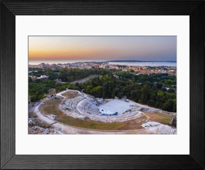 Framed Print : Siracusa, Sicily. Aerial view of the Roman theater with Ortigia island in the background Framed Print : Siracusa, Sicily. Aerial view of the Roman theater with Ortigia island in the background