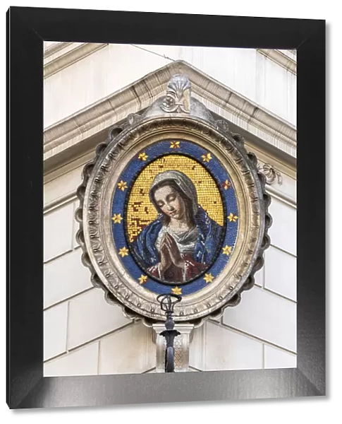 Traditional Madonnella or Madonna mosaic placed in a buildings corner, Rome, Lazio