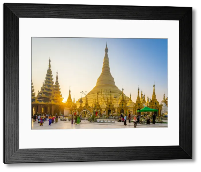 Framed Print : Tourists at gilded Shwedagon Pagoda against clear sky at sunrise, Yangon, Yangon Region