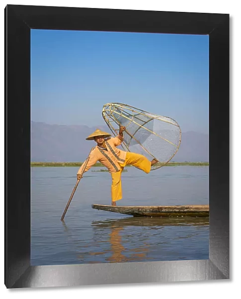 Intha fisherman with a traditional conical fishing, Lake Inle, Nyaungshwe Township