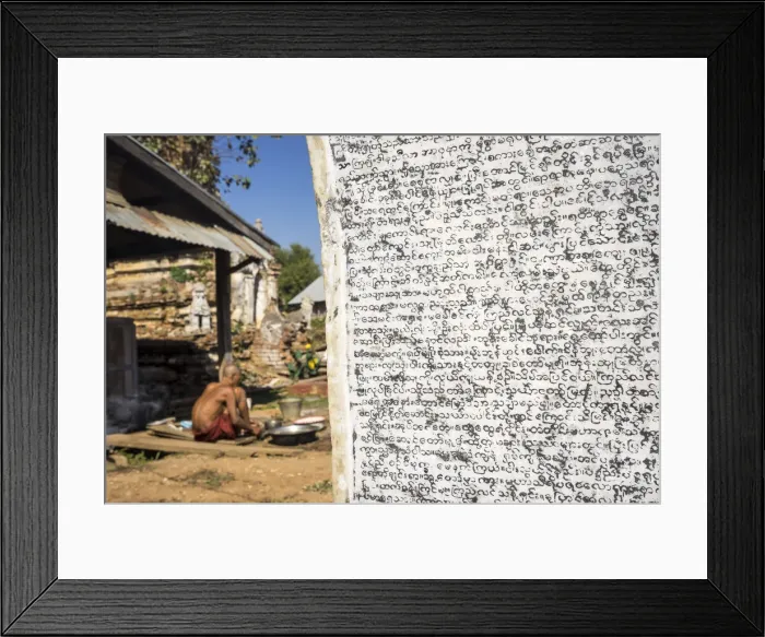 Framed Print : Burmese script on wall with senior Buddhist monk in background, Hsipaw, Hsipaw Township