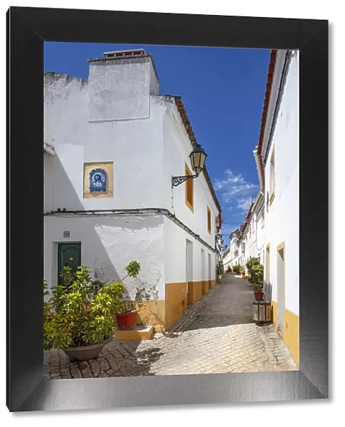 Portugal, Alentejo, Elvas. View along an ancient whitewashed Moorish street in the castle