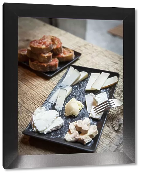 Europe, Spain, Catalonia, Girona, Variety of cheeses in a restaurant in the centre of