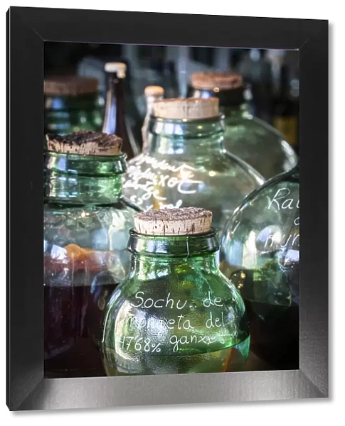 Europe, Spain, Catalonia, Girona, Glass containers with distilled flavours in the El