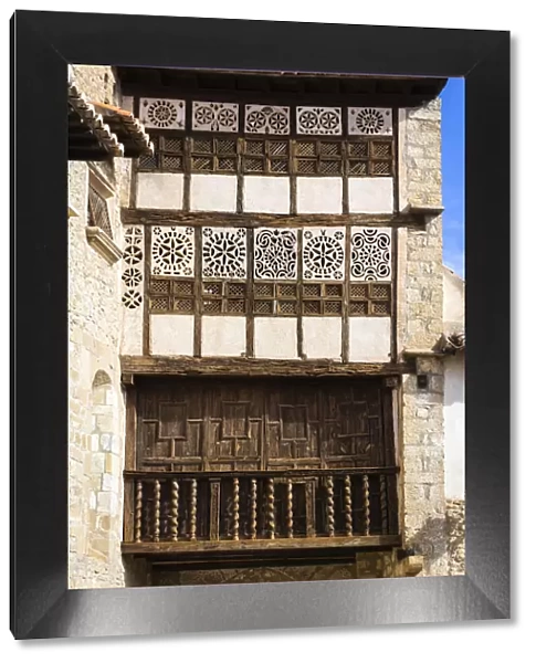 Spain, Aragon, Mirambel, Wood decoration in the balcony of the Portal de las Monjas house