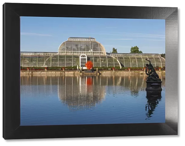 England, London, Richmond, Kew Gardens, The Palm House Reflected in Lake