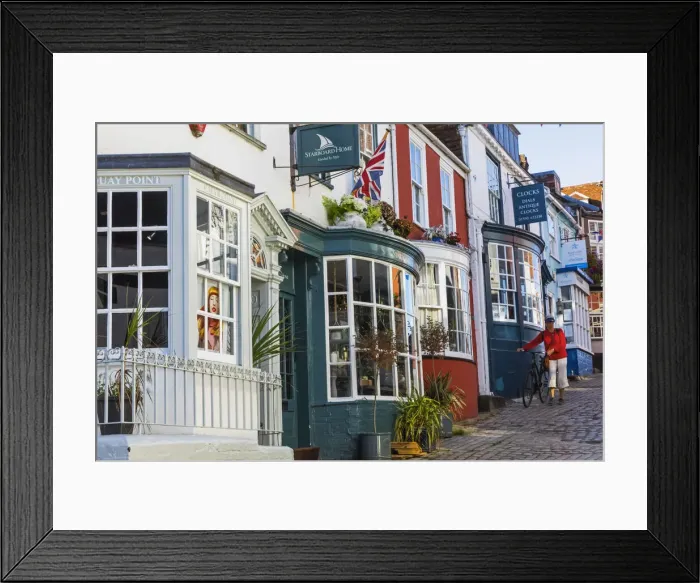 Framed Print : England, Hampshire, The New Forest, Lymington, Colourful Shop Fronts on Quay Hill Framed Print : England, Hampshire, The New Forest, Lymington, Colourful Shop Fronts on Quay Hill