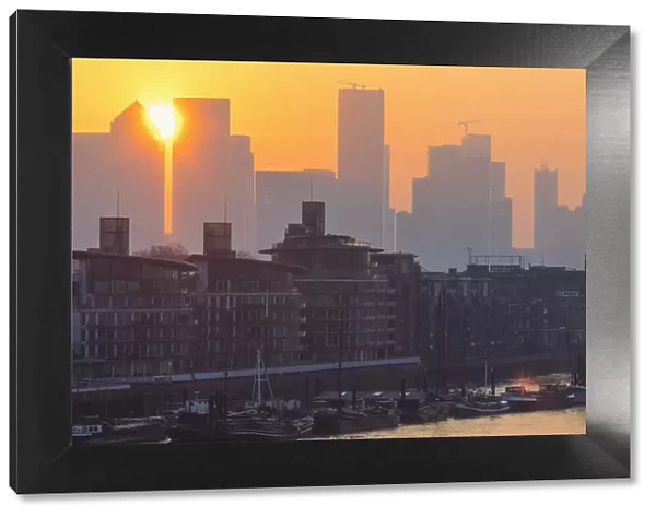 England, London, Docklands, River Thames and Canary Wharf Skyline at Dawn