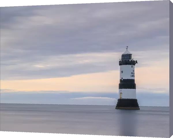 Twilight at Penmon Point Lighthouse on the coast of Anglesey, Wales, UK