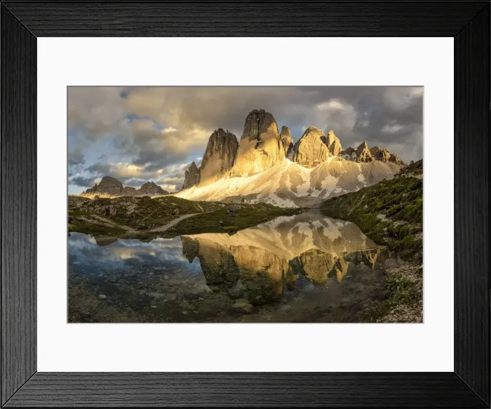 Framed Print : Tre Cime di Lavaredo are reflected in an alpine lake during a sunset with warm light Framed Print : Tre Cime di Lavaredo are reflected in an alpine lake during a sunset with warm light