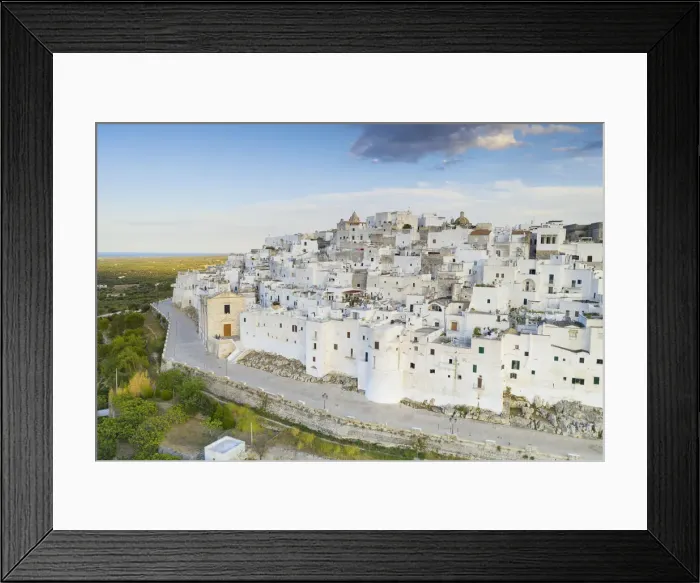 Framed Print : aerial view of Ostuni, so called the white city, during a summer sunset Framed Print : aerial view of Ostuni, so called the white city, during a summer sunset