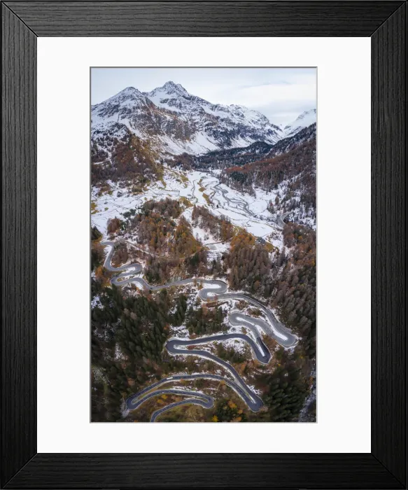 Framed Print : Aerial view of curves of Maloja Pass road and Piz da la Margna in autumn, Bregaglia Valley, Graubunden, Engadine, Switzerland Framed Print : Aerial view of curves of Maloja Pass road and Piz da la Margna in autumn, Bregaglia Valley, Graubunden, Engadine, Switzerland