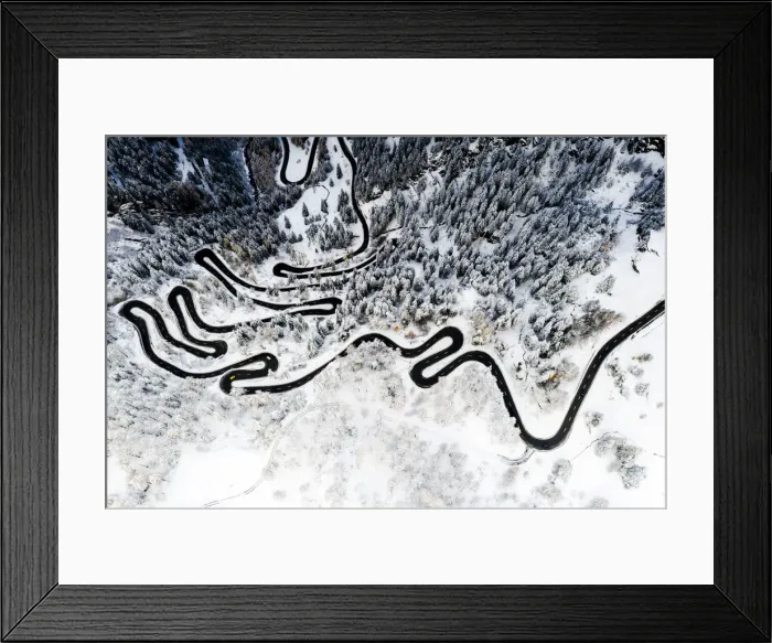Framed Print : Serpentine road crossing the snowy woods, aerial view, Maloja Pass, Bregaglia Valley Framed Print : Serpentine road crossing the snowy woods, aerial view, Maloja Pass, Bregaglia Valley