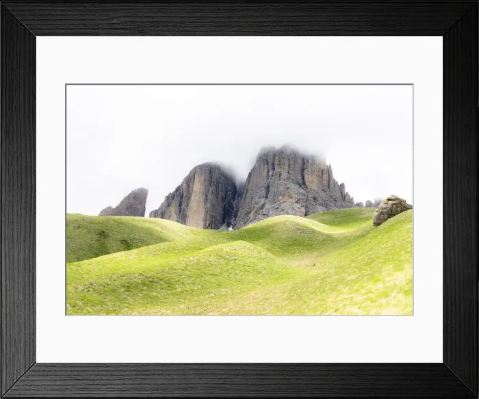 Framed Print : Fog over rocky peaks and green rolling landscape on trail around the Sassolungo group Framed Print : Fog over rocky peaks and green rolling landscape on trail around the Sassolungo group