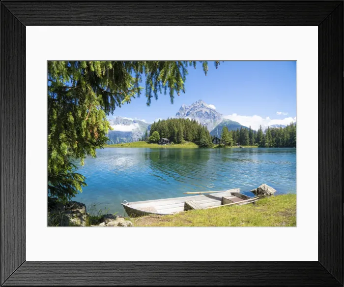 Framed Print : Rowboat moored on shores of Lake Arnisee with Gross Windgallen mountain in the background Framed Print : Rowboat moored on shores of Lake Arnisee with Gross Windgallen mountain in the background