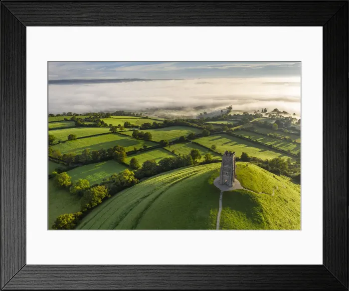 Framed Print : Aerial view of St Michaels Tower on Glastonbury Tor on a misty autumn morning Framed Print : Aerial view of St Michaels Tower on Glastonbury Tor on a misty autumn morning